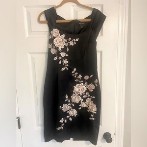 White House Black Market size 6 Black with floral embellishment.
